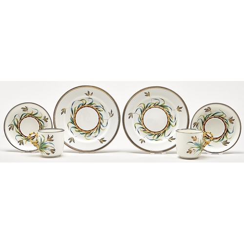 Appraisal: A pair of Staffordshire bone china teacups saucers and plates