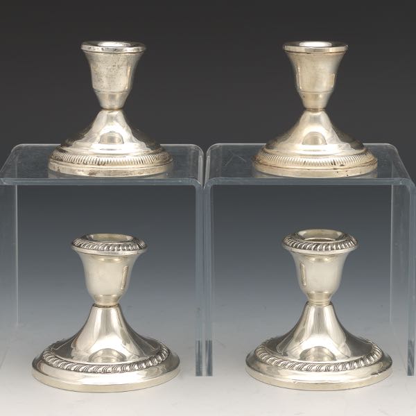 Appraisal: FOUR STERLING SILVER WEIGHTED CANDLEHOLDERS Two pairs of candleholders one