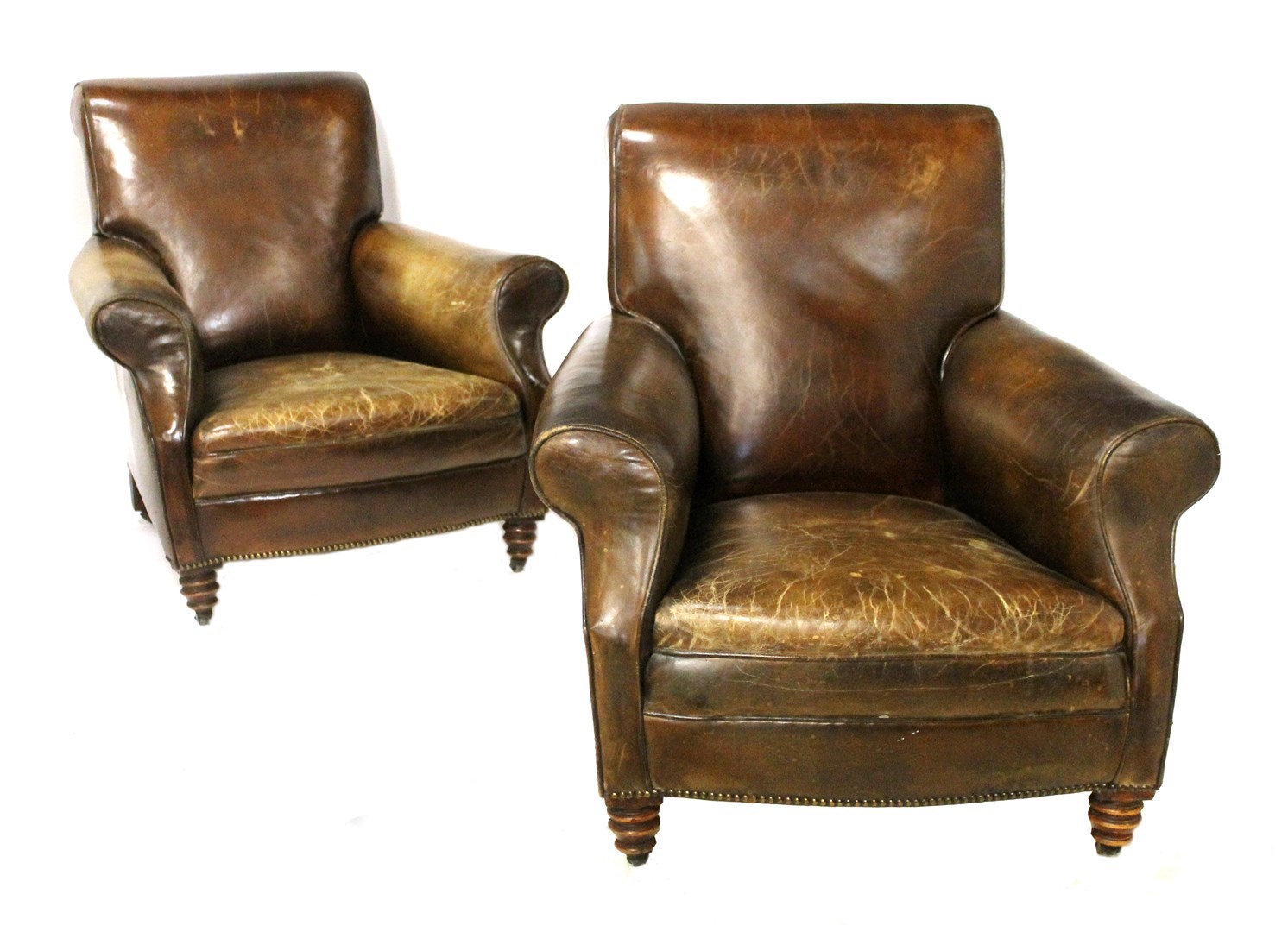 Appraisal: A pair of late th century brass studded leather armchairs