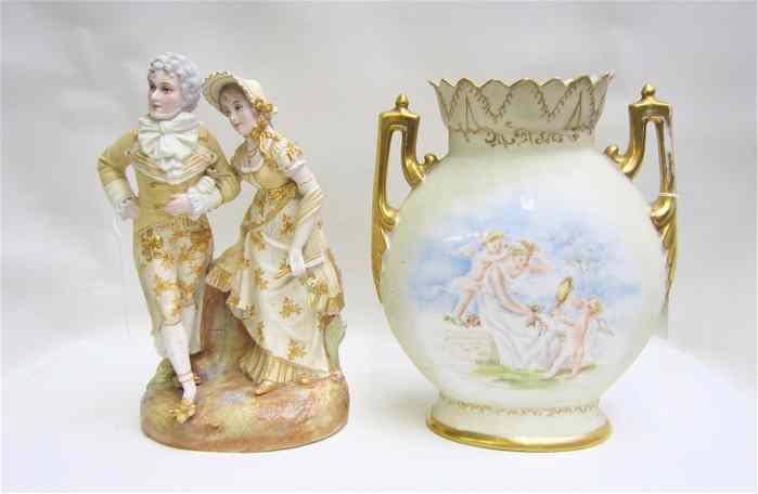 Appraisal: LIMOGES VASE AND GERMAN FIGURAL GROUP the porcelain gilt-double handled