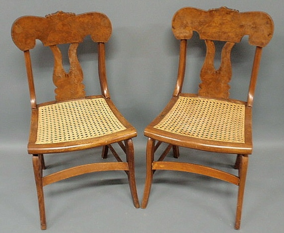 Appraisal: Pair of mahogany side chairs with caned seats and saber