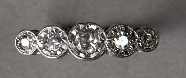 Appraisal: A GRADUATED FIVE STONE DIAMOND RING old cut diamonds mounted