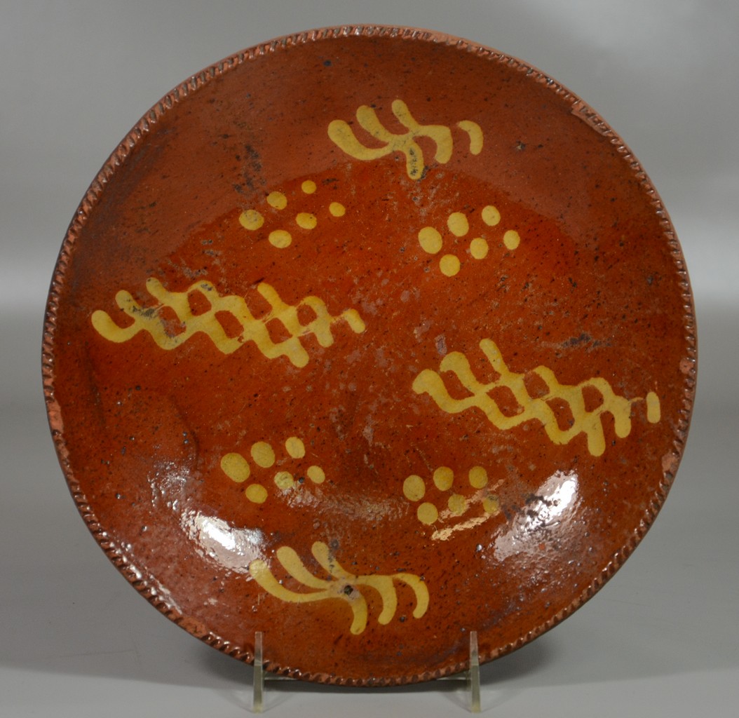 Appraisal: Pennsylvania slip decorated redware pie plate dia minor rim chips