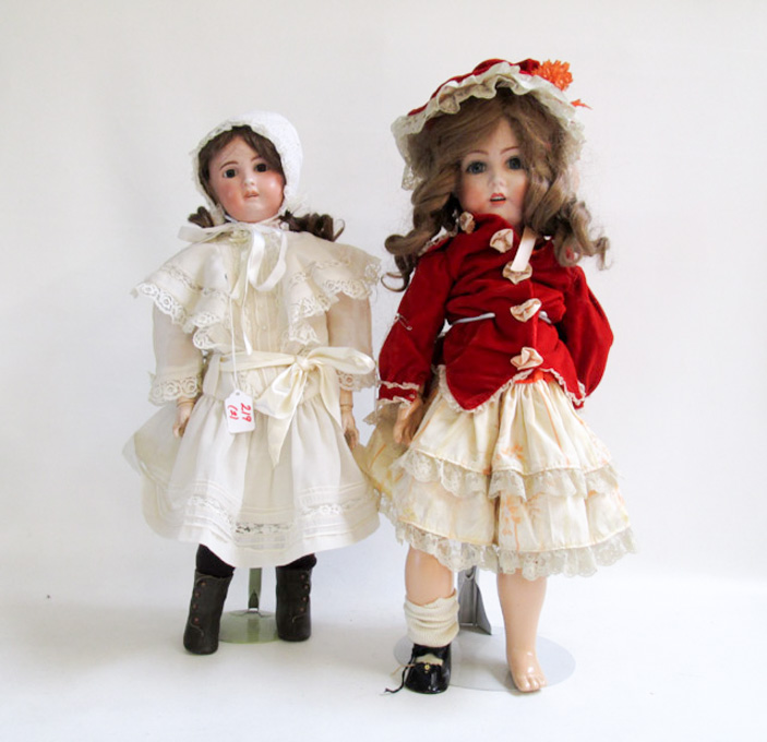 Appraisal: TWO BISQUE SOCKET HEAD GERMAN DOLLS the first long having