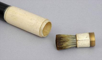 Appraisal: IVORY-HANDLED EBONIZED WOOD WALKING STICK The cylindrical screw-off handle with