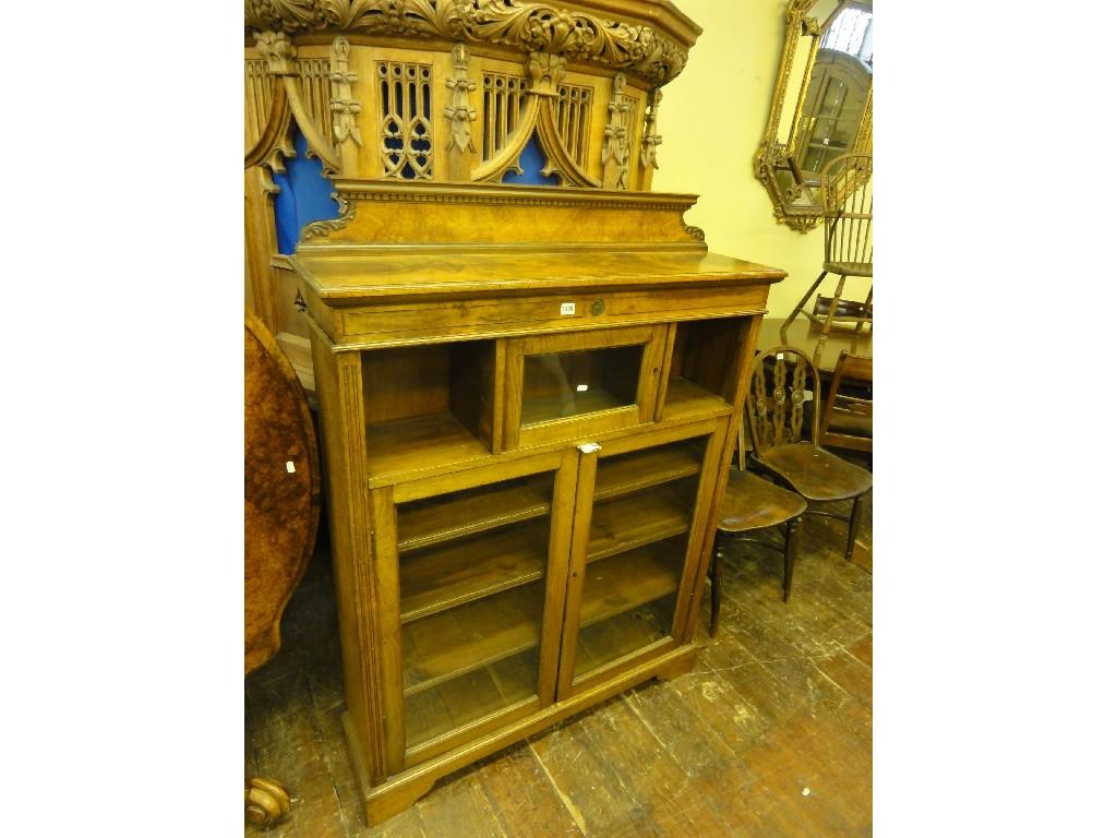 Appraisal: A Victorian figured oak freestanding bookcase the shallow raised architectural