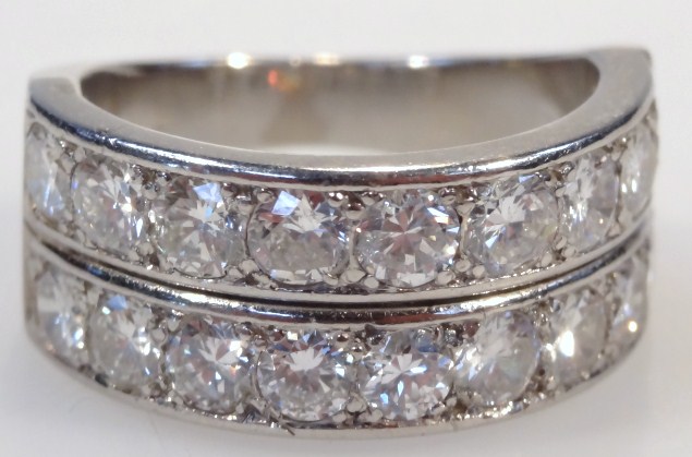 Appraisal: A thC two row diamond half eternity ring comprising eighteen