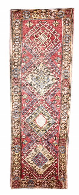 Appraisal: A TURKISH PASTEL RUNNER with quadruple diamond motif within a