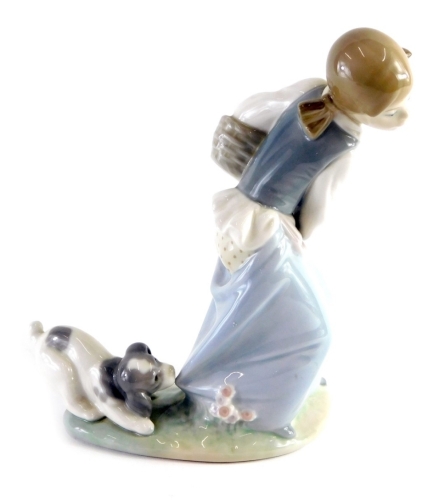 Appraisal: A Lladro figure of a girl holding basket being attacked