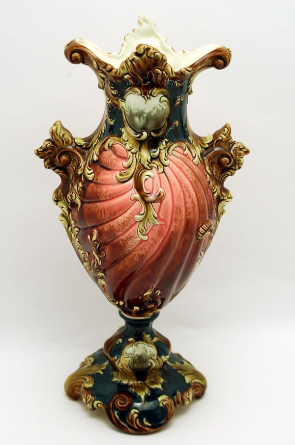 Appraisal: Majolica footed vase circa ribbed body two handles decorated overall