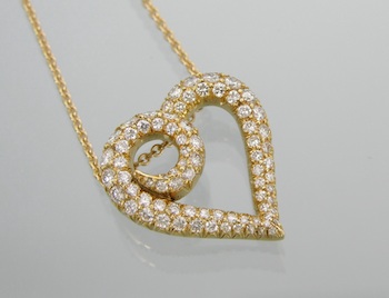 Appraisal: An k Gold and Diamond Heart Pendant k yellow gold