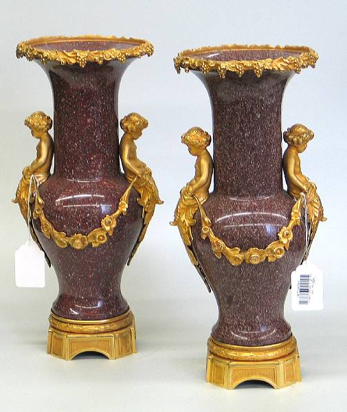 Appraisal: A pair of Neoclassical style gilt bronze mounted red granite