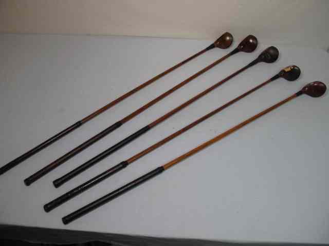 Appraisal: Fancy face wood shaft golf clubs total Includes a BurrKey