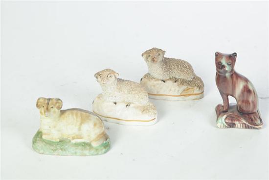 Appraisal: FOUR ANIMAL FIGURINES American and European th century ceramic Seated