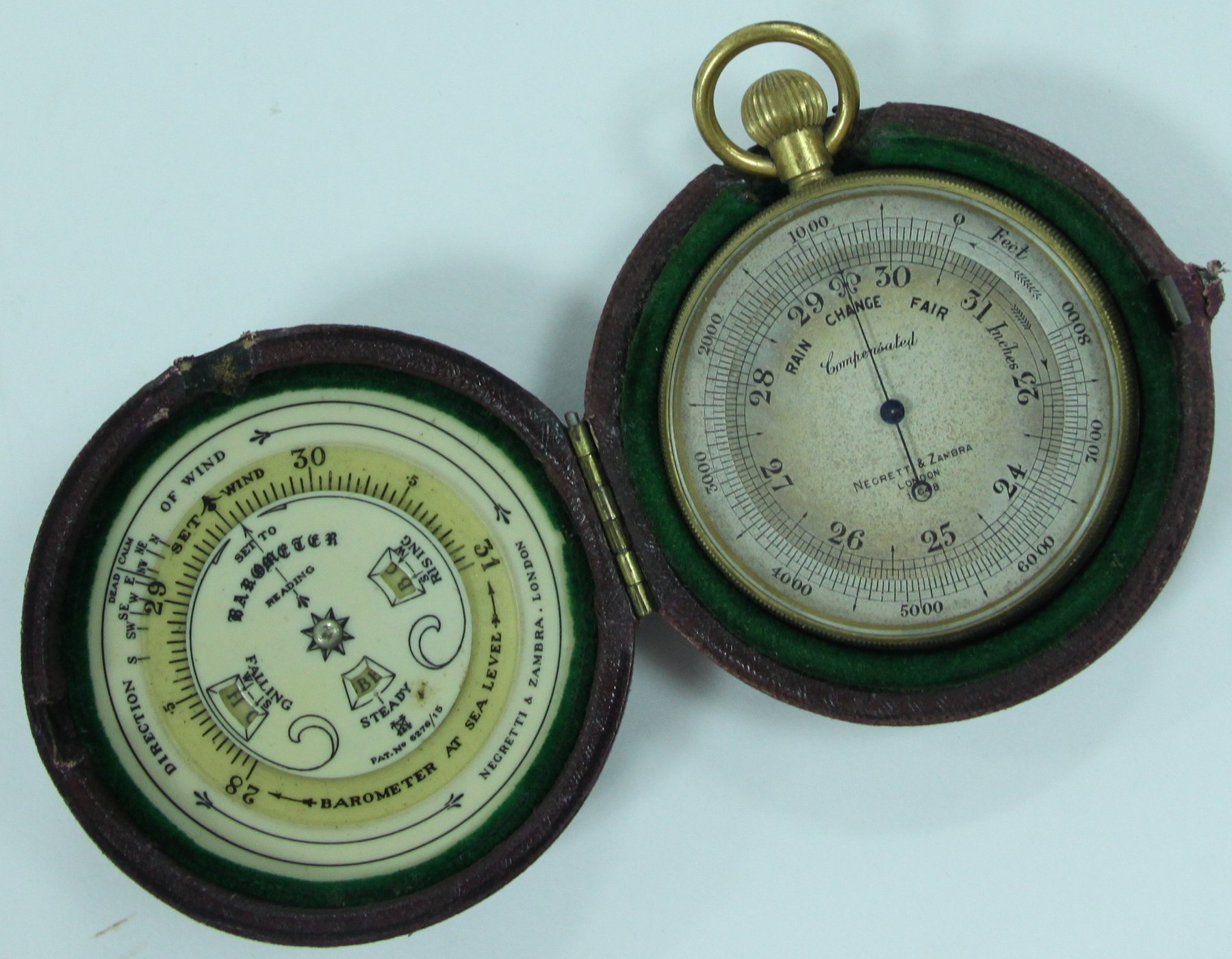 Appraisal: A pocket aneroid barometer in a leather case