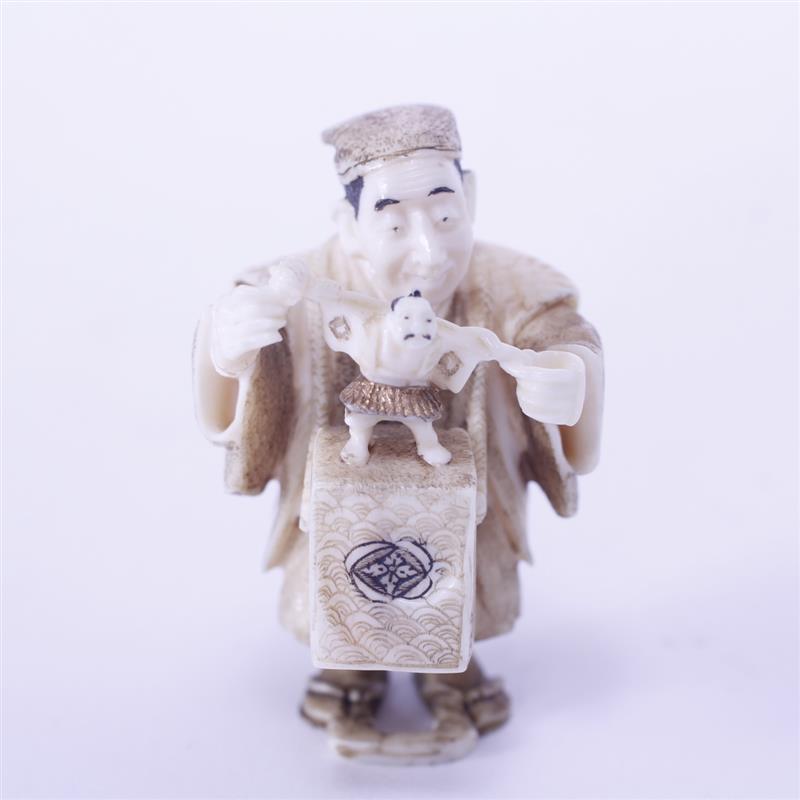 Appraisal: Japanese Carved Ivory Male Figure with toy H x W