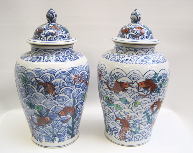 Appraisal: PAIR OF CHINESE COVERED GINGER JARS in an orange fish