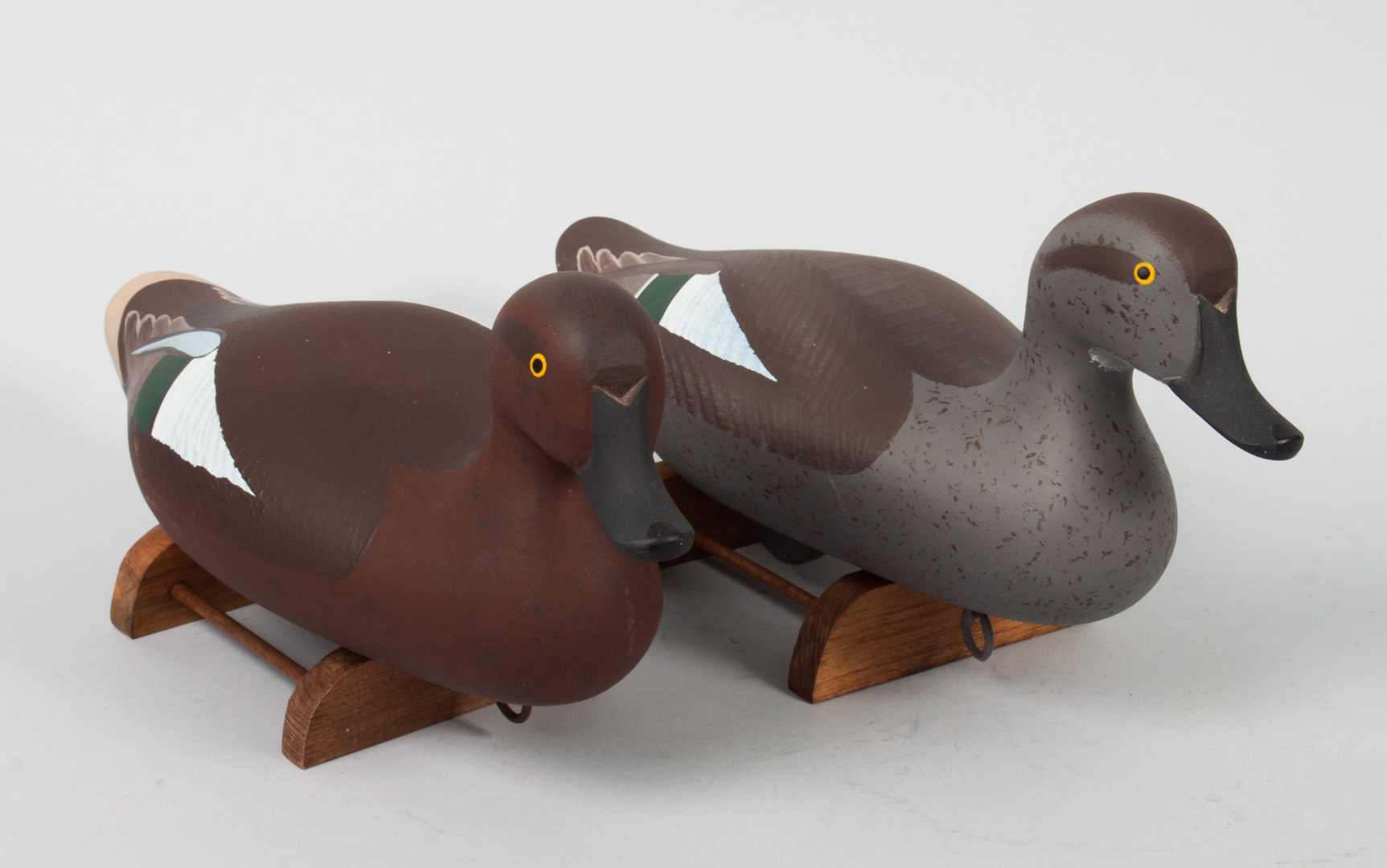 Appraisal: Pair of carved and polychromed wood duck decoys by Patrick