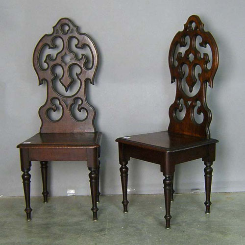 Appraisal: Pair of Victorian walnut hall chairs th c