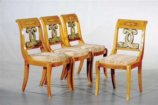 Appraisal: Four Biedermeier style carved cherry side chairs scrolled back over