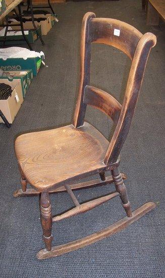 Appraisal: A th Century elm seated chair with turned legs on