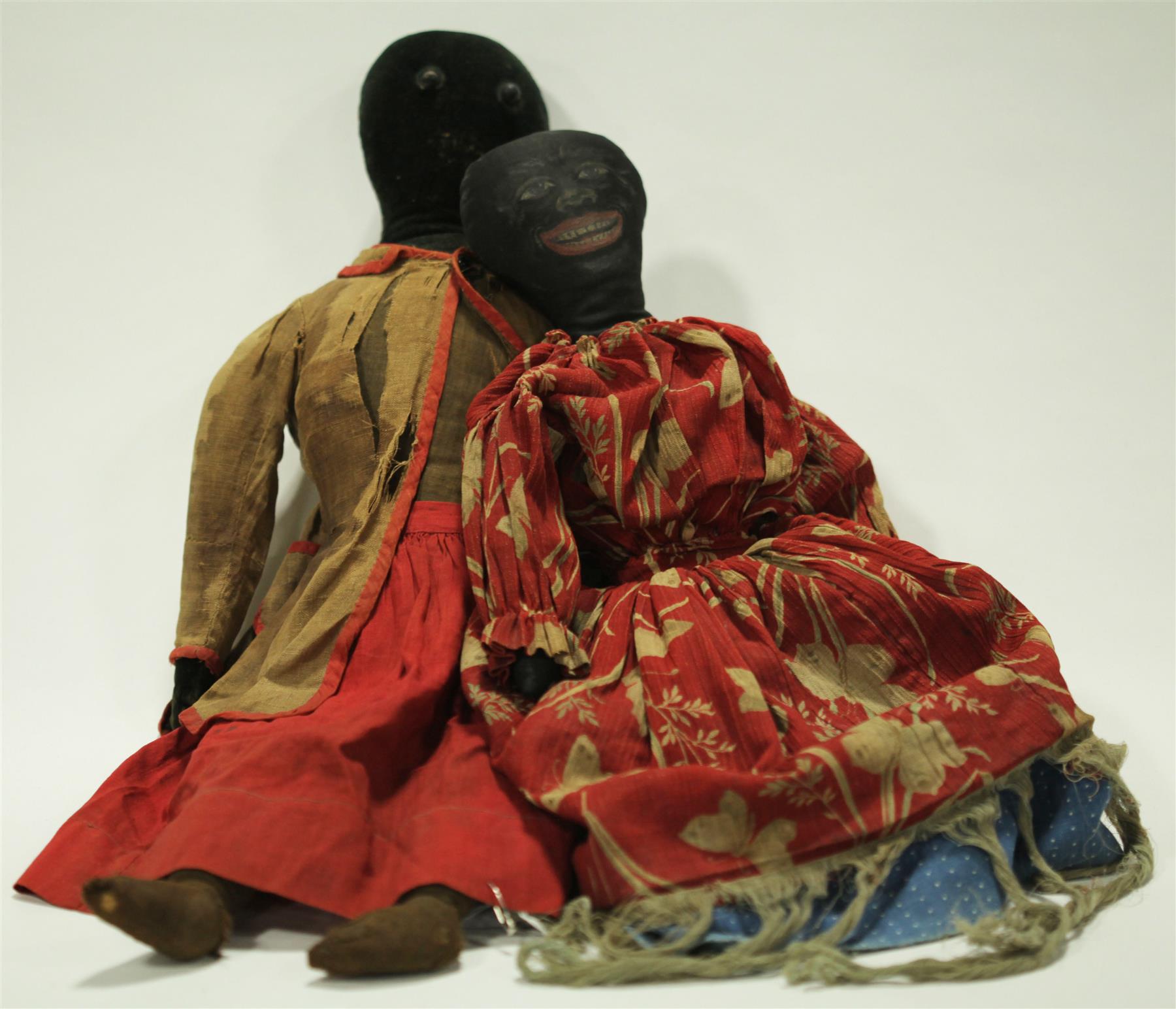 Appraisal: AN EARLY BLACK DOLL WITH VELVET HEAD AND AN EARLY