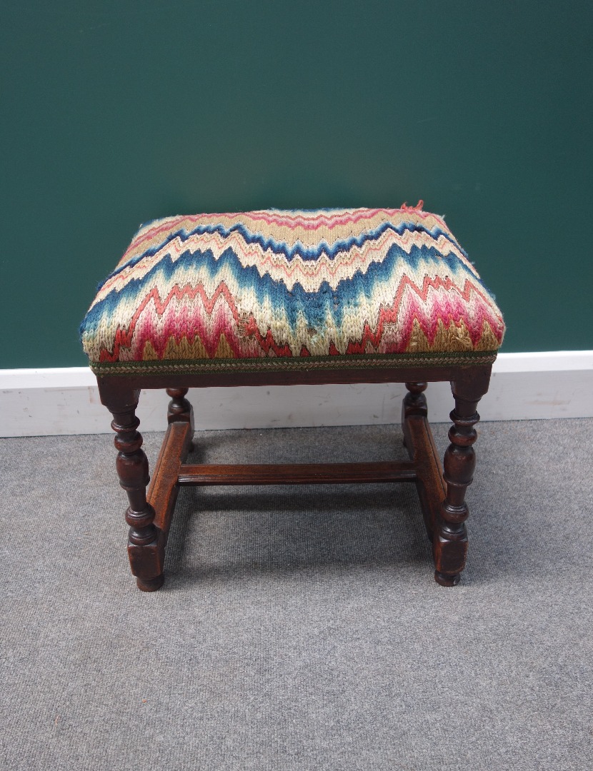 Appraisal: An early th century French fruitwood stool the rectangular over