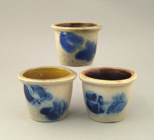 Appraisal: Three miniature stoneware crocks ca with cobalt floral decoration h