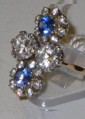 Appraisal: A DRESS RING comprising two large white stones within two