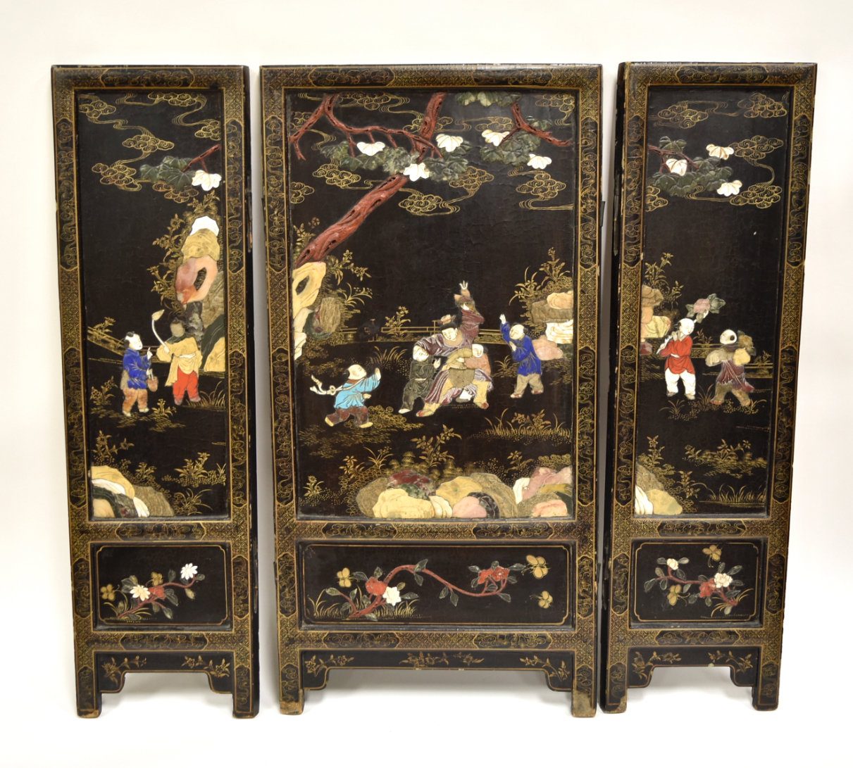 Appraisal: Three Chinese wood screen black gilt lacquered panels finely inlaid