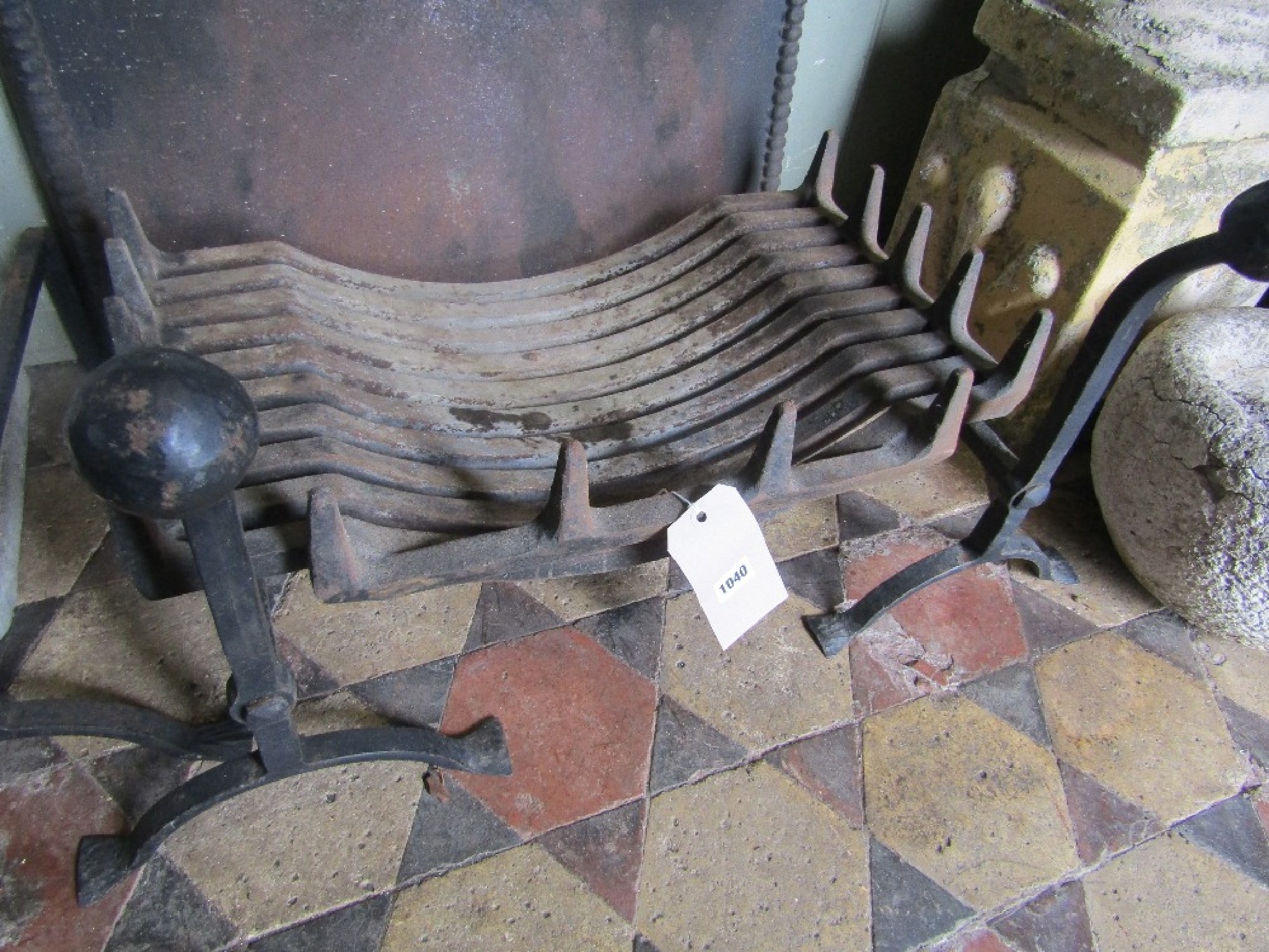 Appraisal: A heavy cast iron fire grate and loose dogs with