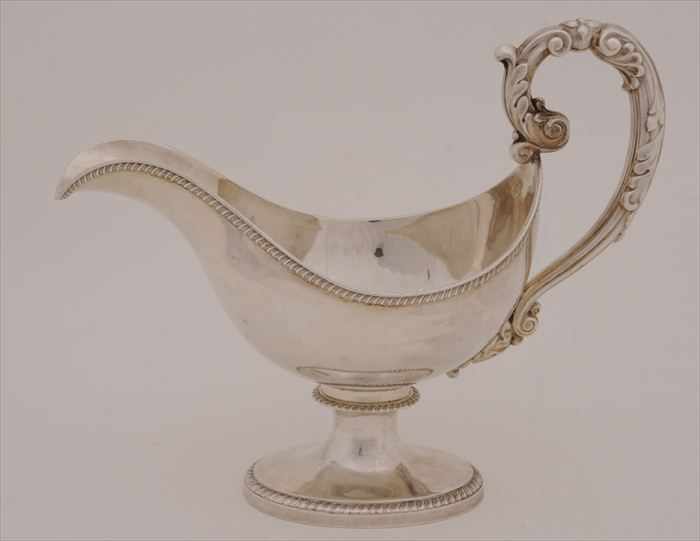 Appraisal: FRENCH SILVER GRAVY BOAT With applied narrow gadrooned rim hollow