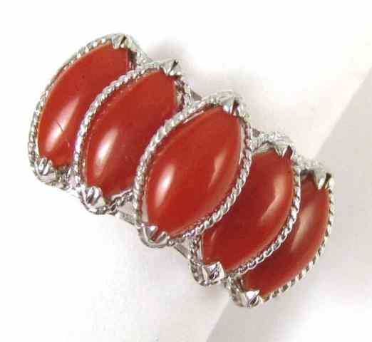 Appraisal: CORAL AND FOURTEEN KARAT WHITE GOLD RING set with five