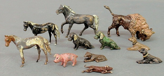 Appraisal: Group of eleven paint decorated metal animals largest h