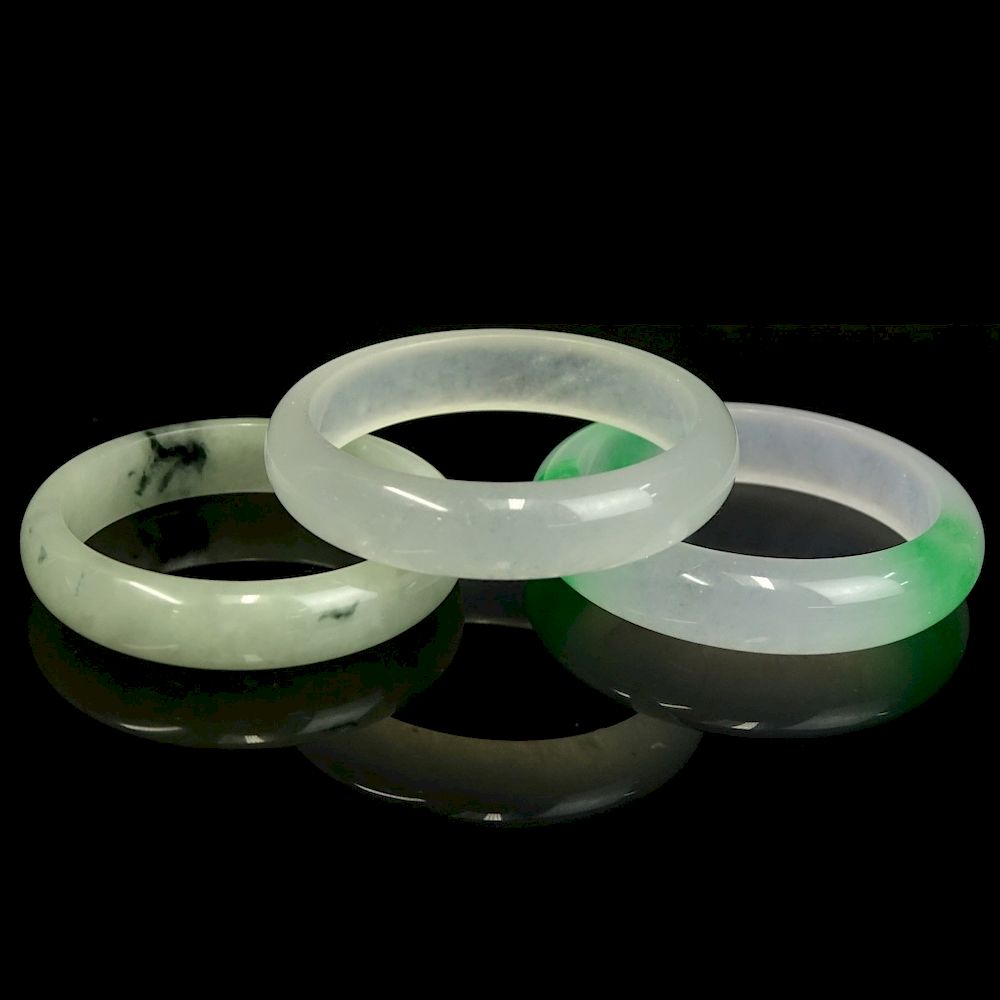 Appraisal: Three Chinese Jade Bangle Bracelets Three Chinese Jade Bangle Bracelets