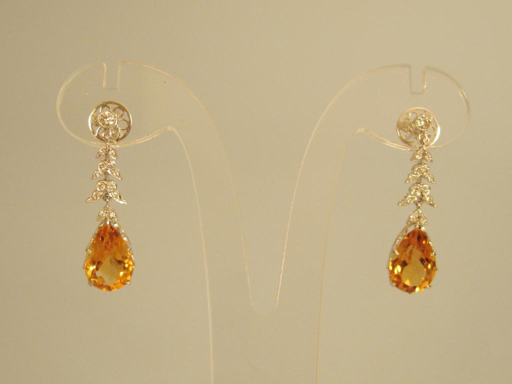 Appraisal: A pair of Citrine and Diamond Ear Pendants each with