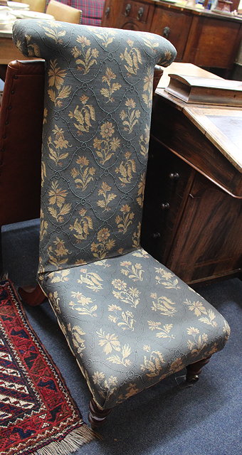 Appraisal: A VICTORIAN UPHOLSTERED PRIE DIEU LOW CHAIR with turned mahogany