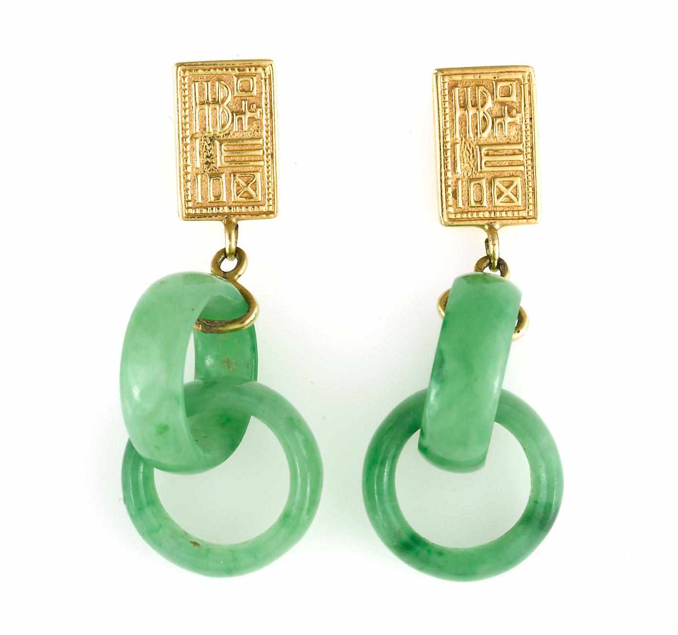 Appraisal: A pair of jadeite jade earrings mounted in fourteen karat