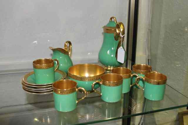 Appraisal: A ROYAL WORCESTER PART COFFEE SET in green with gilt