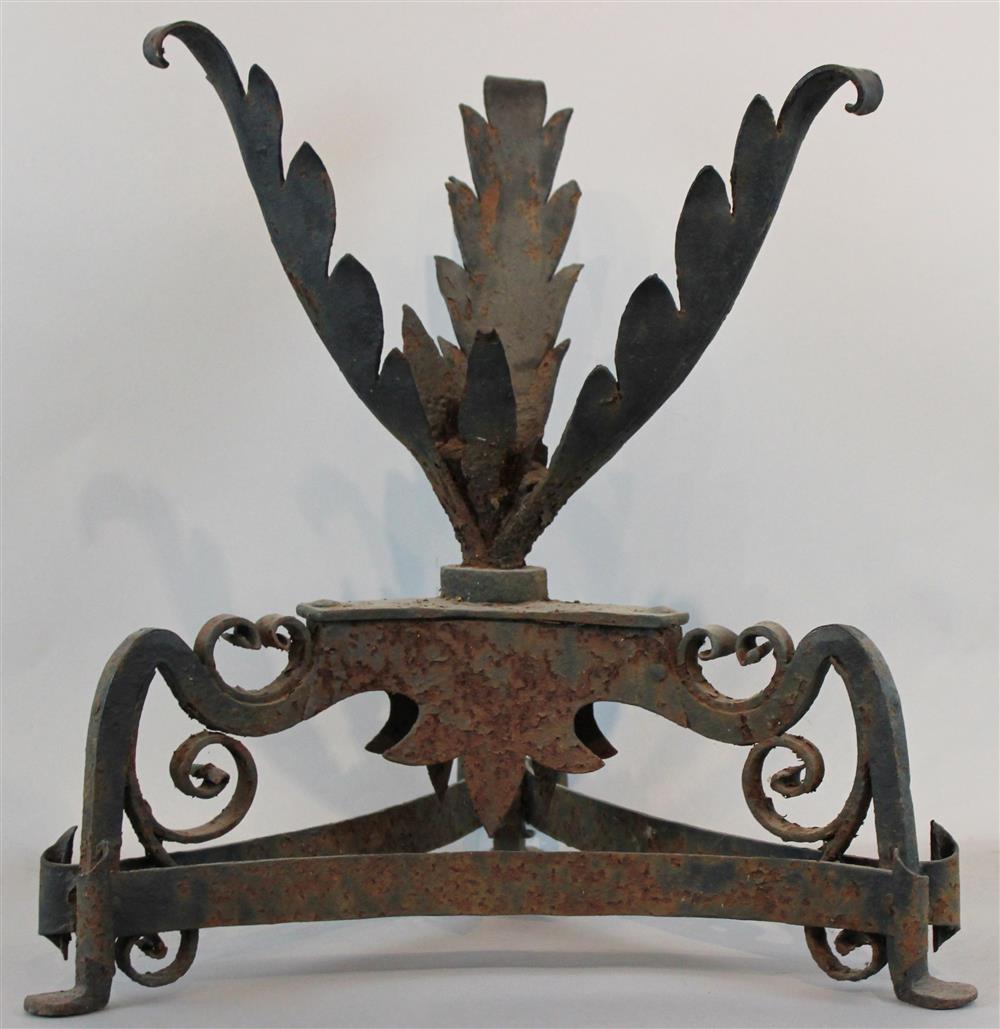 Appraisal: IRON TORCHERE WITH PALM FROND DESIGN AND SCROLLED BASE h