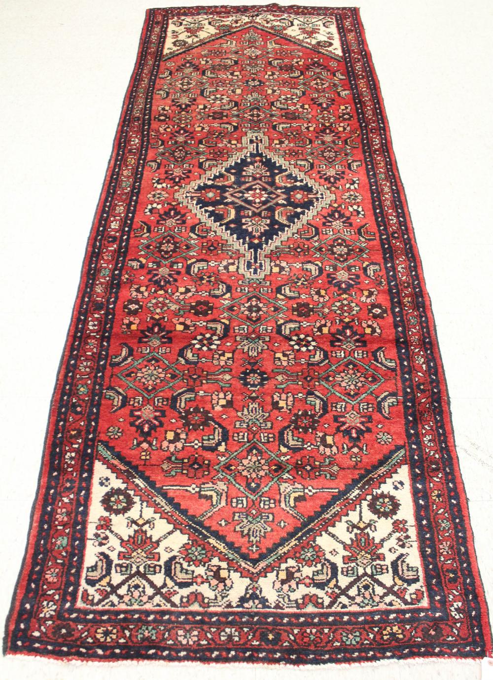 Appraisal: SEMI-ANTIQUE PERSIAN AREA RUG central diamond medallion and surrounding Herati