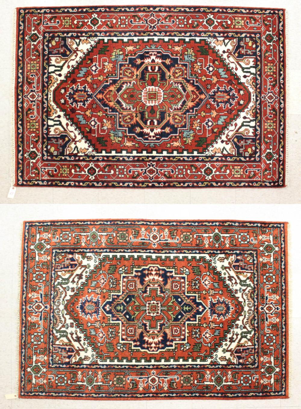 Appraisal: A PAIR OF HAND KNOTTED ORIENTAL AREA RUGS Indo-Persian Serapi