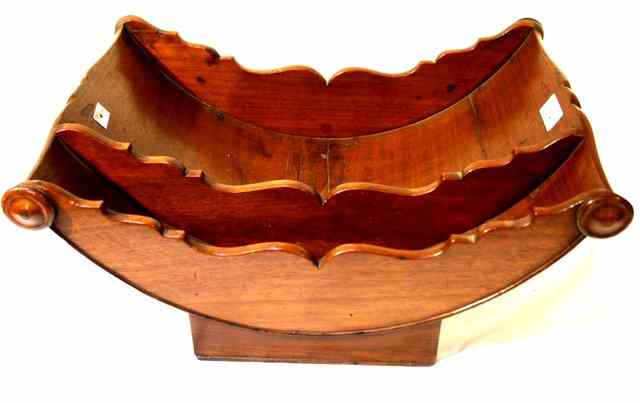 Appraisal: A GEORGE III MAHOGANY CHEESE COASTER of boat shape the