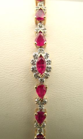 Appraisal: k yellow gold ruby and diamond tennis bracelet with twenty