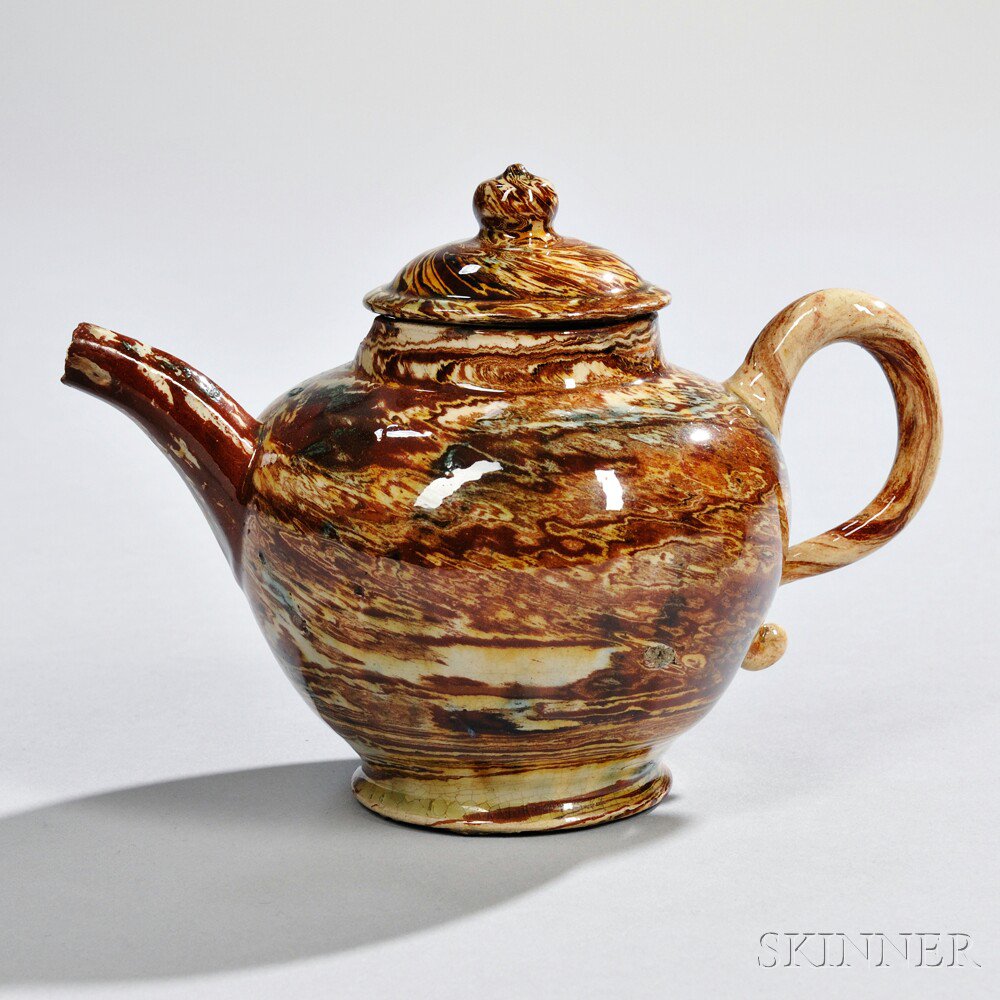 Appraisal: Staffordshire Solid Agate Teapot and Cover England c globular shape