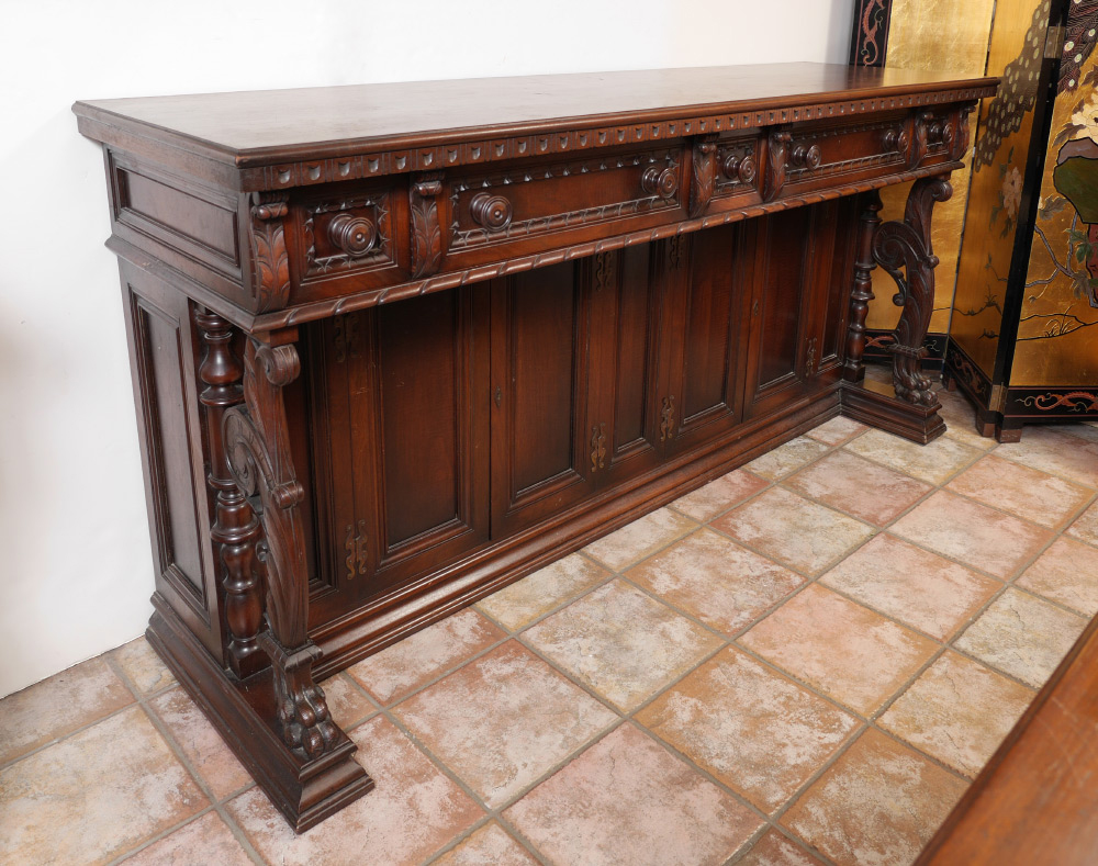 Appraisal: CENTURY FURNITURE CARVED SIDEBOARD Gothic revival style cabinet with carved