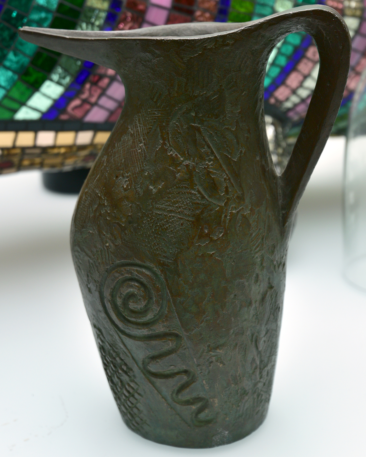 Appraisal: A BRONZE JUG WITH INSCRIBED DECORATION