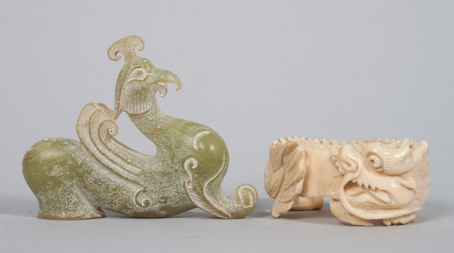 Appraisal: Chinese carved jade and ivory dragon Archaic manner jade dragon