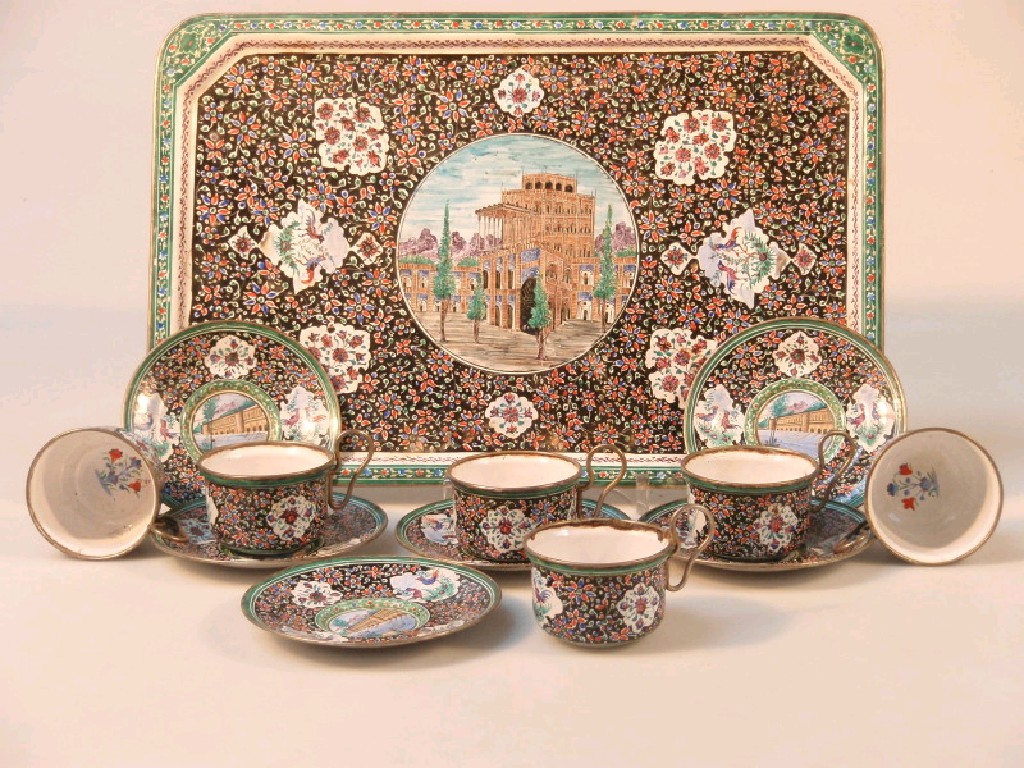 Appraisal: A Middle Eastern enamelled coffee set of six cups and