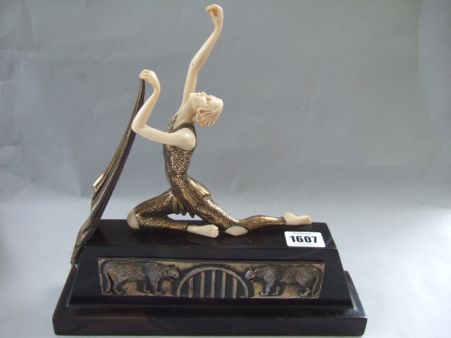 Appraisal: An Art Deco style figure modelled as a kneeling dancer